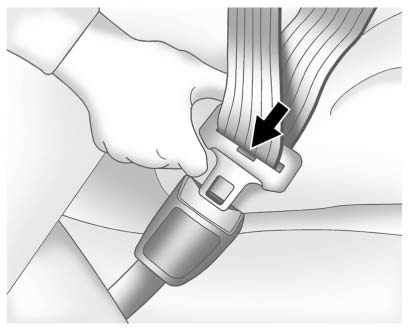 Buick Enclave safety belt latch plate inserted into buckle until it clicks