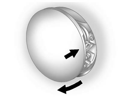 Fuel cap removal instruction showing slow counterclockwise turning on the Buick Enclave