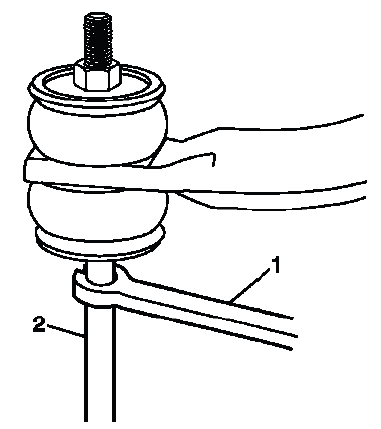 Rear stabilizer shaft link held with wrench during service