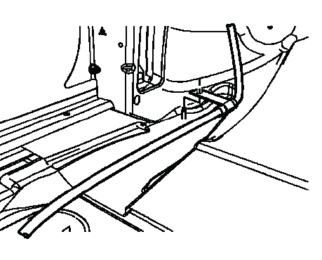 Park brake cable routing clip under driver floor carpet