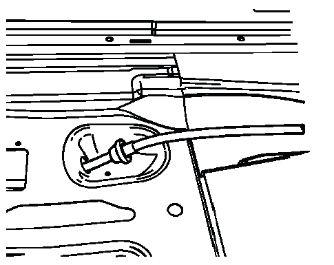 Front park brake cable pass through grommet at floor opening