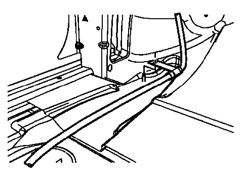 Park brake cable routing clip positioned on floor stud