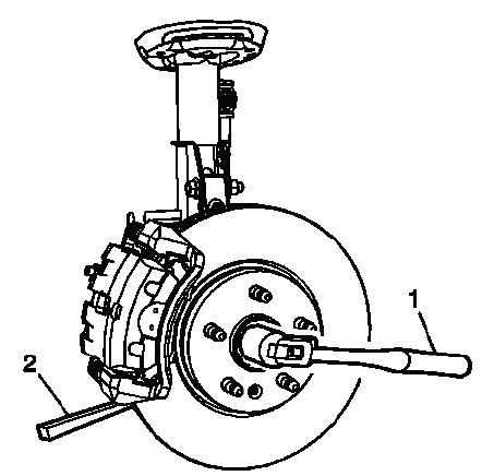 Front wheel drive shaft nut tightening with brass drift at brake rotor