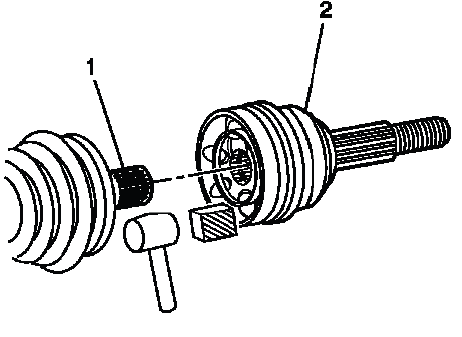 Separating the rear CV joint from the axle shaft with a hammer and wood block