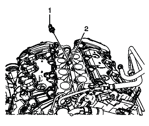 Power steering fluid reservoir outlet hose connected to reservoir bracket area